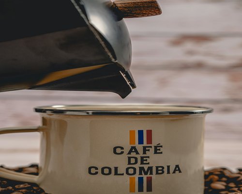 person enjoying coffee in a bright Colombian café